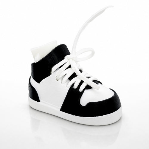 Black and white high-top sneaker on a light gray background