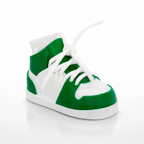 Green and white sneaker on a light gray background