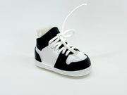 Black and white high-top sneaker on a light gray background
