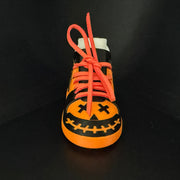 Sugar Skull Shoe Pair, front view of the jack-o'-lantern face on the toe.