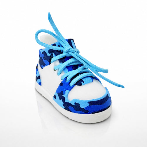 Blue Camo Shoe Pair, three-quarter view. White shoe shell with royal, sky and navy blue camo panels and light blue laces.