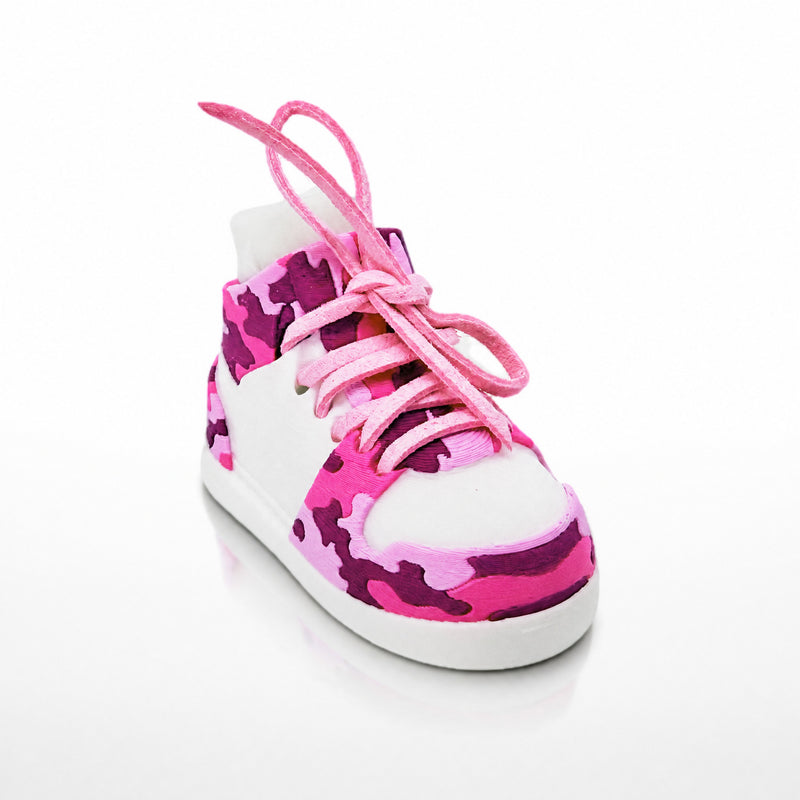 Pink Camo Shoe Pair, three-quarter view. White shoe shell with pink and plum camo panels and pink laces.