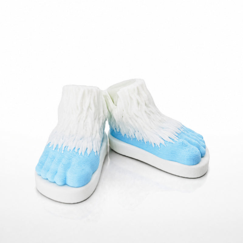 Yeti Feet Pair. Two Yeti foot shells with icy blue toes and shaggy white fur.