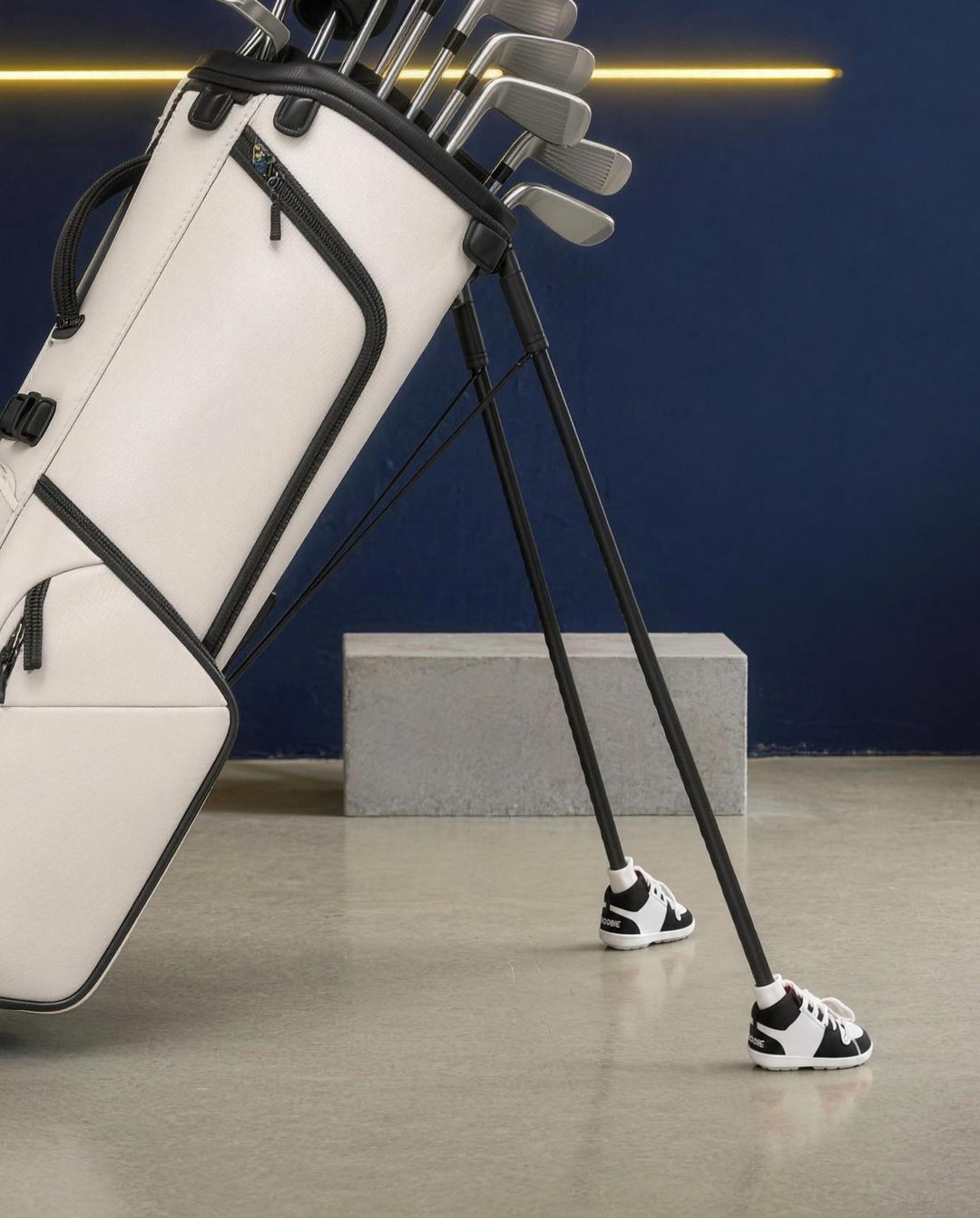 Black & White Shoobies on a golf bag's stand legs
