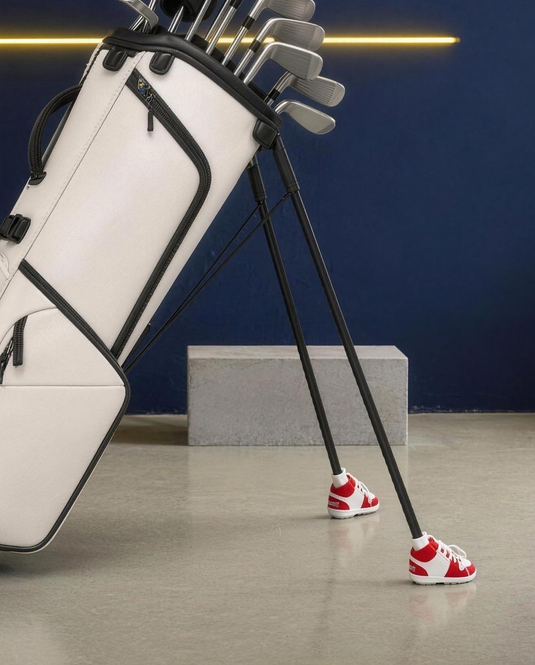 Red & White Shoobies on a golf bag's stand legs
